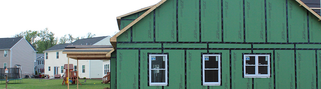 House under construction with sheathing exposed