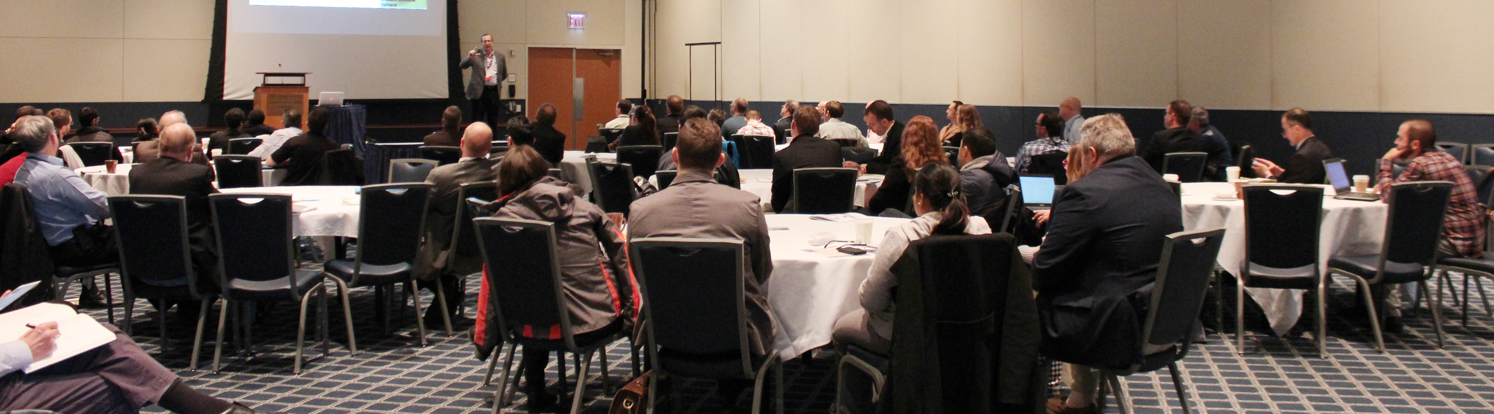 Conference attendees listening to keynote speaker, Dr. John Straube