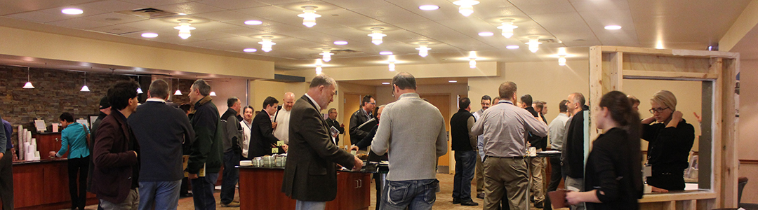 Conference attendees networking in exhibit space